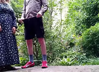 brunette cougar with big tits takes two cocks