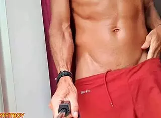 Muscular man cums inside fleshlight at window while curious neighbors watch his big cock.