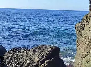 Rough Fuck Doll Moans During Web Chat, Gets Cum In Mouth On Cliff By The Sea