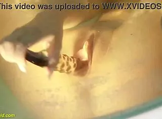 Katty West, the sexy teen, fingers her big shaved pussy with a dildo in the bathtub!