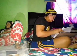 Hey, I’m stroking my huge coño while my stepsister does university homework!