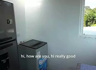 Waiting for husband while technician works in kitchen