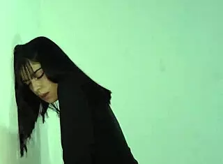 Laura in red skirt is caught masturbating, spanked, and penetrated against the wall outdoors