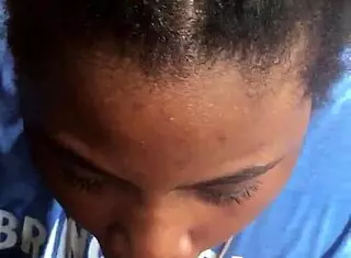 Ebony teen sucks cock in the pouring rain