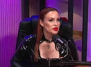 Is the redhead milf queen domme licking pussy in bdsm party?