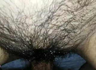 He fucks her fat hairy pussy doggystyle while she's bent over