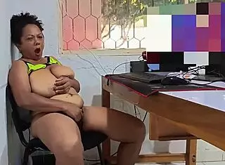 Busty mature woman masturbates in the office during break