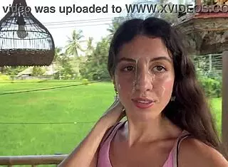 cute girl enjoys burger in public cafe