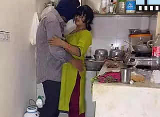 Husband Surprises Wife While Cooking in the Kitchen