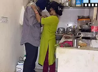 Husband Surprises Wife While Cooking in the Kitchen