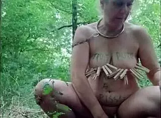 European milf slave humiliated in forest with dildo and handcuffs