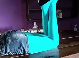 Beautiful Latina MILF shows off her legs in pantyhose and heels on the desk