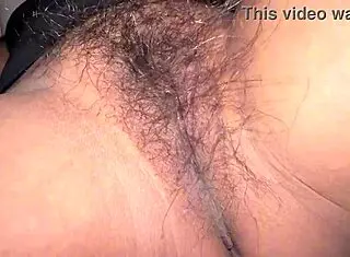Horny desi rubs her hairy pussy