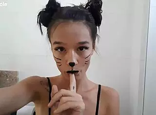 cute skinny girl with small tits engages in bathroom body painting fetish