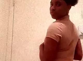 Ebony Girl Reveals Chocolate Ass In Bathroom Setting