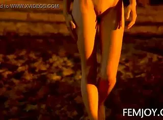 German busty blonde teen Corinna shines nude at sunset outdoors.