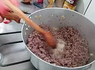 sarah rosa prepares sexy seasoned ground meat in the kitchen