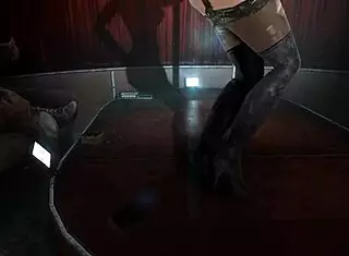 A woman performs a striptease, dancing and undressing while ripping her clothes.