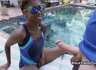 Ebony teen princess gives detailed blowjob to monster cock by outdoor pool