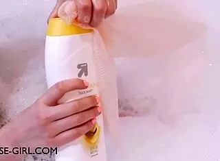 Petite brunette relaxes in bath