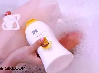 Petite brunette relaxes in bath