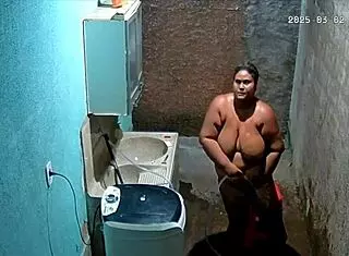 The stepmom shaves her pussy while the stepson secretly watches from the camera.