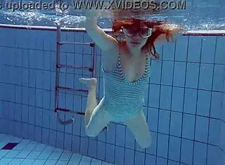 Libuse, the sexy petite Russian teen with small tits, hangs out at the pool and beach with her blonde girlfriend babe.