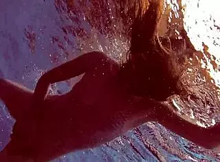 Libuse, the sexy petite Russian teen with small tits, hangs out at the pool and beach with her blonde girlfriend babe.