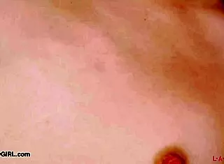 Red-haired model reveals her body in photoshoot.