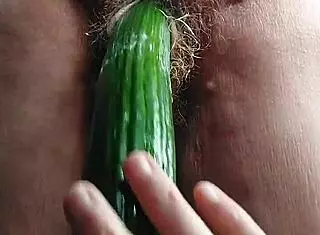 oma fucks her old hairy pussy with a cucumber – so wild!