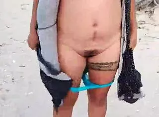 Mexican Whore Exhibits Tits and Ass on Public Beach
