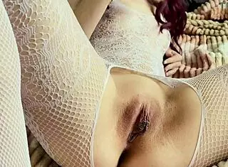 Hey, check this girl in white bodysuit moaning as she masturbates her tight pussy