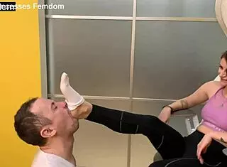 sporty mistress sofi dominates her slave by making him sniff and lick her sweaty socks during femdom session