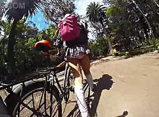 trans in minifalda exhibits upskirt on city streets with pigtails