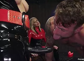 Are you ready for latex femdoms to whip our tattooed slave in bondage?