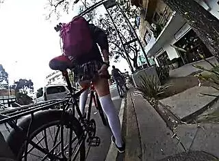 trans in minifalda exhibits upskirt on city streets with pigtails