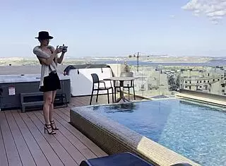 Daisy takes to the skies as a pilot, flashing her assets in a solo pool dance session. She teases with dirty talk and ass worship.