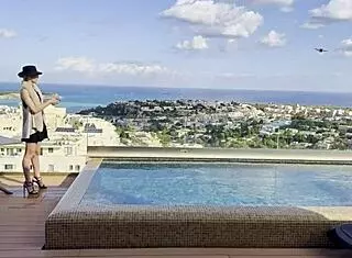 Daisy takes to the skies as a pilot, flashing her assets in a solo pool dance session. She teases with dirty talk and ass worship.