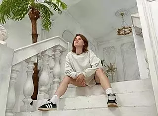 Young student girl arrives for a professional photo shoot session.