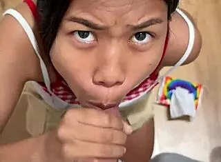 Skinny 18-year-old Asian student sucks big interracial cock in changing room pov and swallows cumshot.