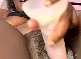 Ebony beauty with creamy pretty pussy teases solo using toys in close up homemade session