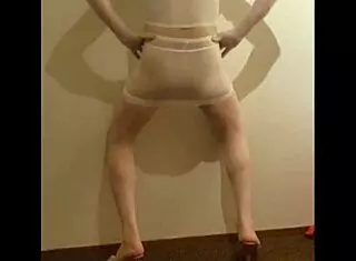 crossdresser maria struts in white nylon pantyhose and high heels, showing off skirt, shorts, dress, feet, pantyhose, shoes, panties, stockings, leggings, miniskirt, and see-through nylon layers casually