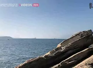 pervertida shows tits on beach and fucks hard among rocks