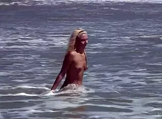 Gorgeous teen Agnes with big tits and cute ass bathes naked body in ocean outdoors