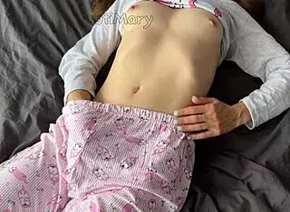 teen in pajamas fingers her shaved pussy to squirt then takes cumshot from a huge cock