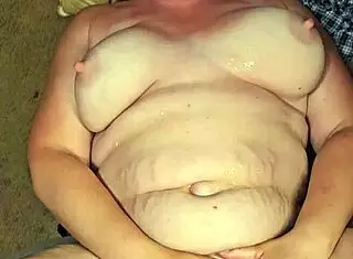 Man pissing on submissive whore with big tits