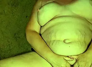 Man pissing on submissive whore with big tits