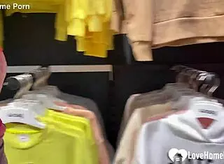 My girlfriend drops to her knees for a blowjob in the changing booth