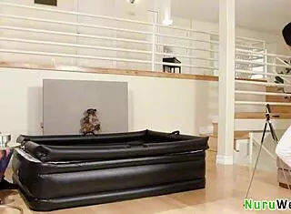 sexy brunette with nice natural big boobs massages her hairy bush on clients back