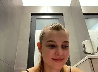 The amateur teen casually fingered her wet pussy in a public outdoor spot.